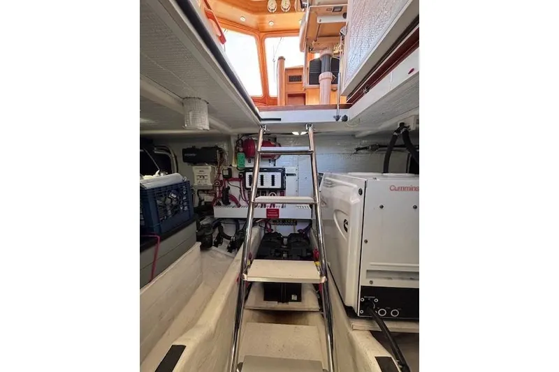 Slide: The Image of Engine room of 2012 Sabre 42 Salon Express with visible equipment and ladder. - 38