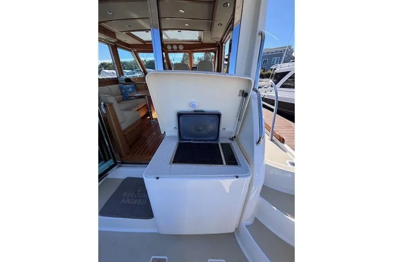 Slide: The Image of 2012 Sabre 42 Salon Express yacht with open outdoor grill and luxurious interior. - 4