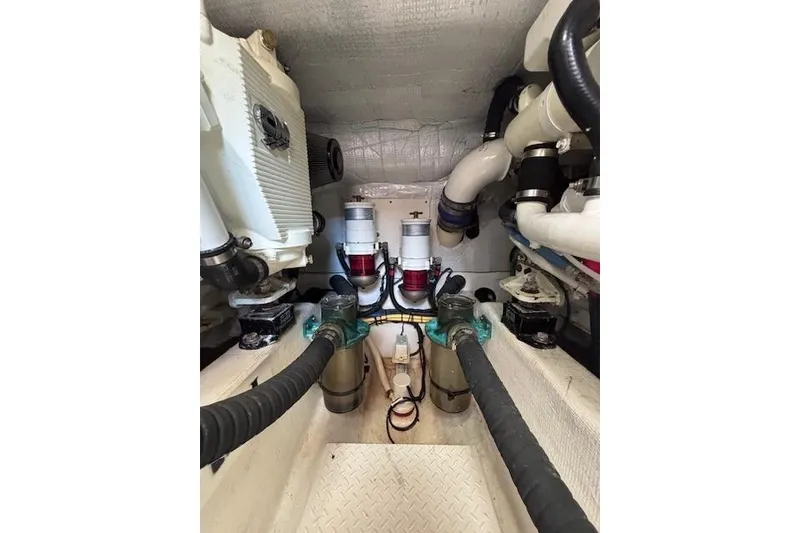 Slide: The Image of Engine room of 2012 Sabre 42 Salon Express with visible pipes and machinery. - 40