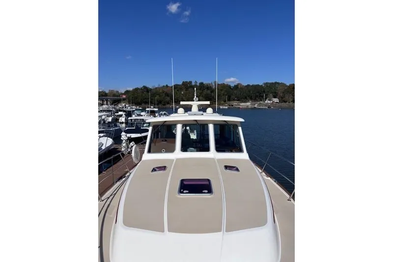 Slide: The Image of 2012 Sabre 42 Salon Express yacht on calm water, clear sky background. - 41