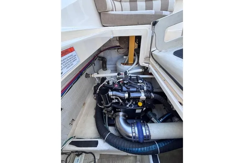 Slide: The Image of Engine compartment of 2012 Sabre 42 Salon Express boat, showcasing mechanical components. - 6