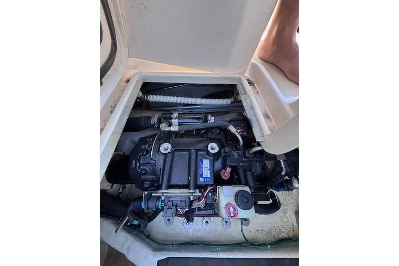 Slide: The Image of Engine compartment of a 2012 Sabre 42 Salon Express boat, showing mechanical components. - 7