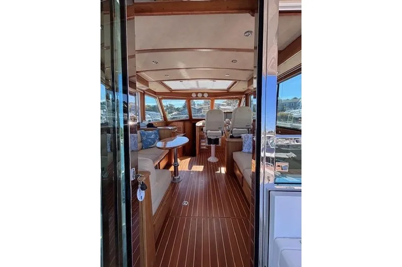 Slide: The Image of Interior of 2012 Sabre 42 Salon Express yacht with elegant wood finish and seating. - 8