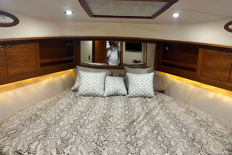 Slide: The Image of Luxurious 2017 Palm Beach PB42 yacht cabin with elegant bedding and ambient lighting. - 29