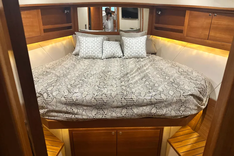 Slide: The Image of Luxurious cabin interior of 2017 Palm Beach PB42 yacht with cozy bedding and wooden accents. - 30