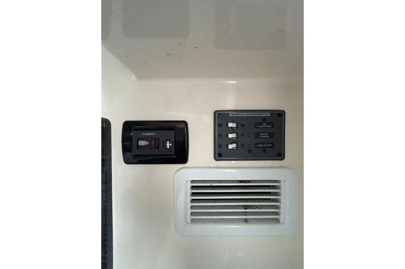 Slide: The Image of Control panel and vent on 2020 Cobia 350 Center Console boat. - 17