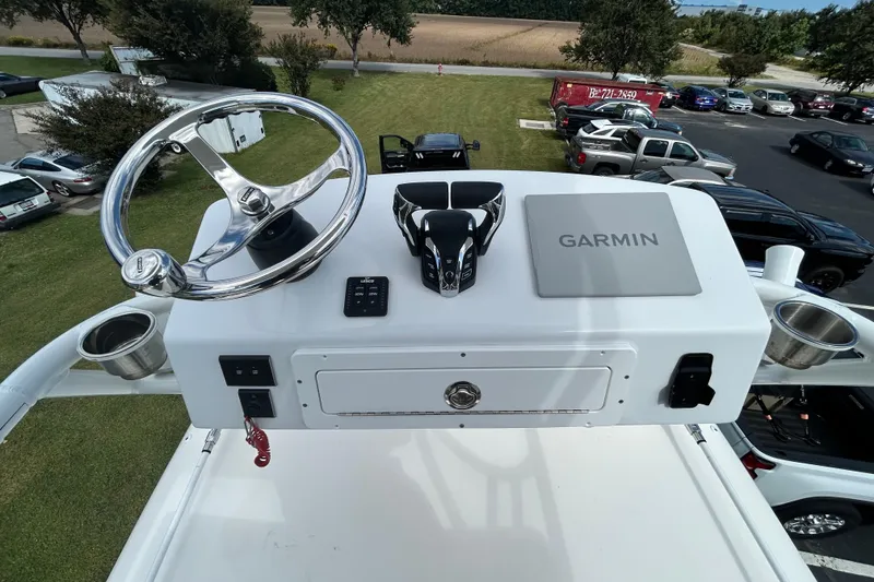 Slide: The Image of 2020 Cobia 350 Center Console helm with Garmin navigation and steering wheel. - 21