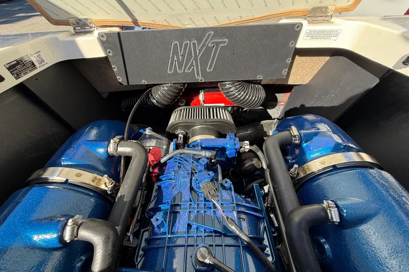 Slide: The Image of Engine compartment of 2022 MasterCraft NXT24 boat, showcasing detailed components and design. - 27
