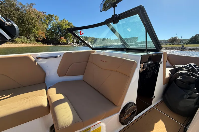 Slide: The Image of Interior of 2022 MasterCraft NXT24 boat with tan seating and open windshield. - 40