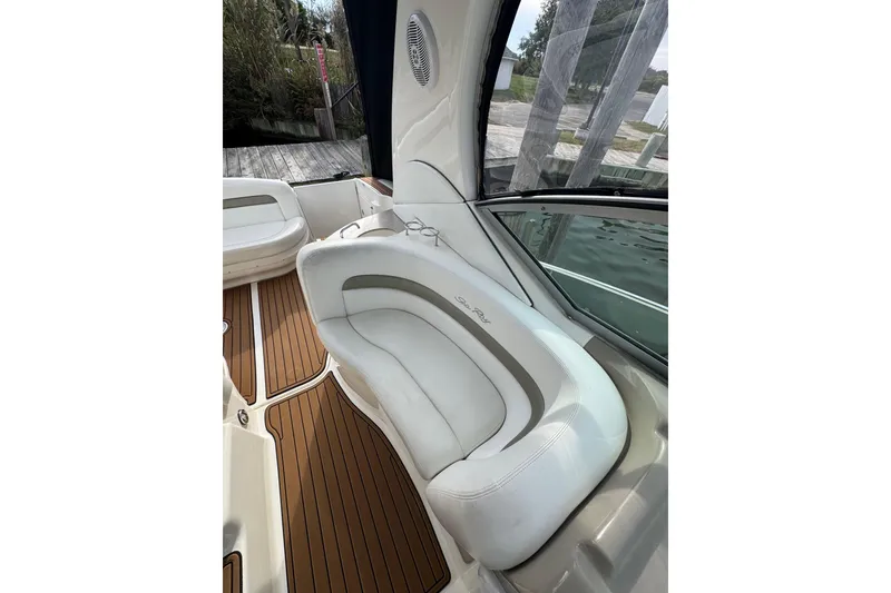 Slide: The Image of 2007 Sea Ray 320 Sundancer interior with white seating and teak flooring. - 13