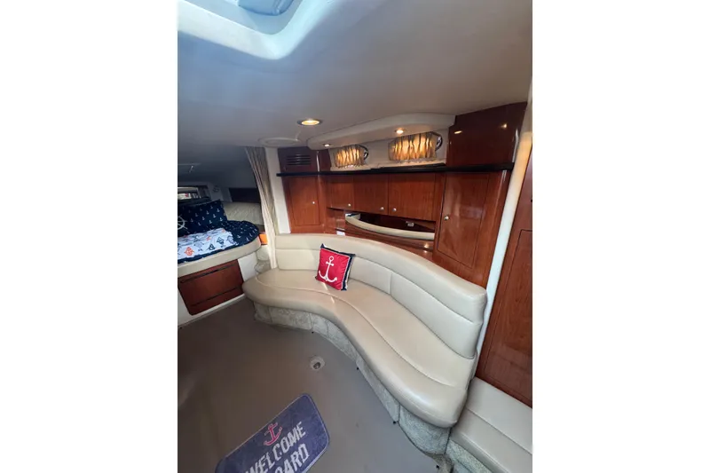 Slide: The Image of Interior of 2007 Sea Ray 320 Sundancer with elegant seating and nautical decor. - 21