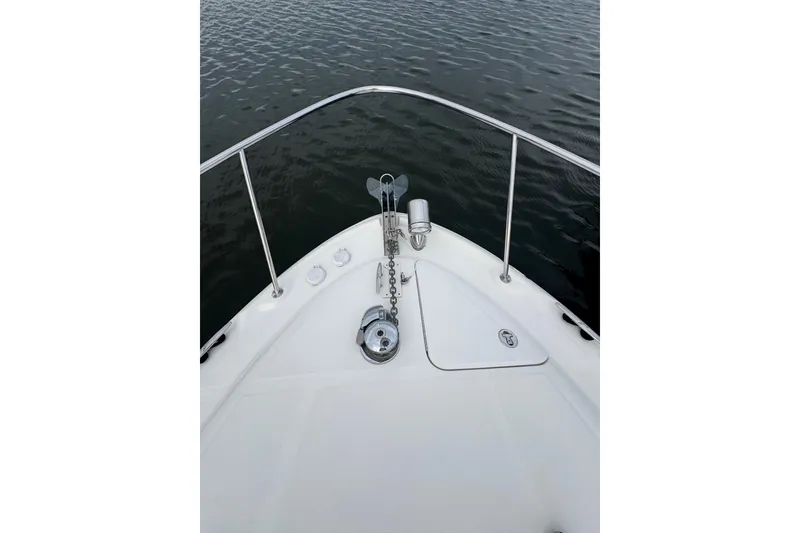 Slide: The Image of Bow of 2007 Sea Ray 320 Sundancer with anchor chain and calm water view. - 35