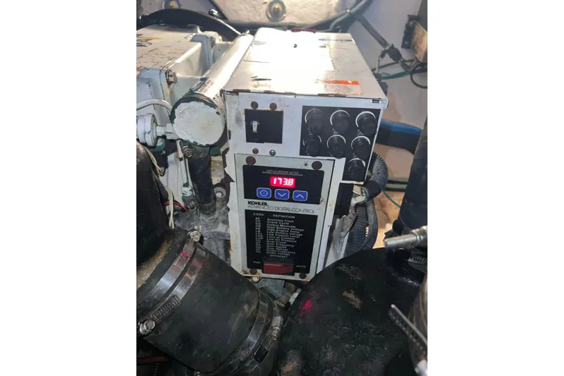 Slide: The Image of Engine compartment of 2007 Sea Ray 320 Sundancer with Kohler digital control panel. - 37