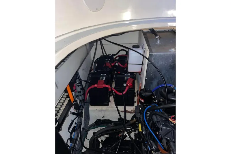 Slide: The Image of Engine compartment of 2007 Sea Ray 320 Sundancer with visible batteries and wiring. - 39