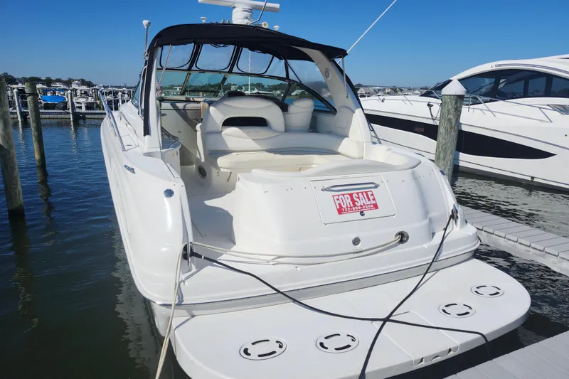 Slide: The Image of 2002 Sea Ray 410 Sundancer yacht for sale, docked at marina. - 11