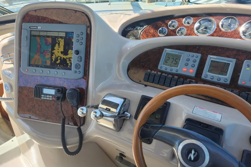 Slide: The Image of Control panel of a 2002 Sea Ray 410 Sundancer boat with navigation equipment. - 18