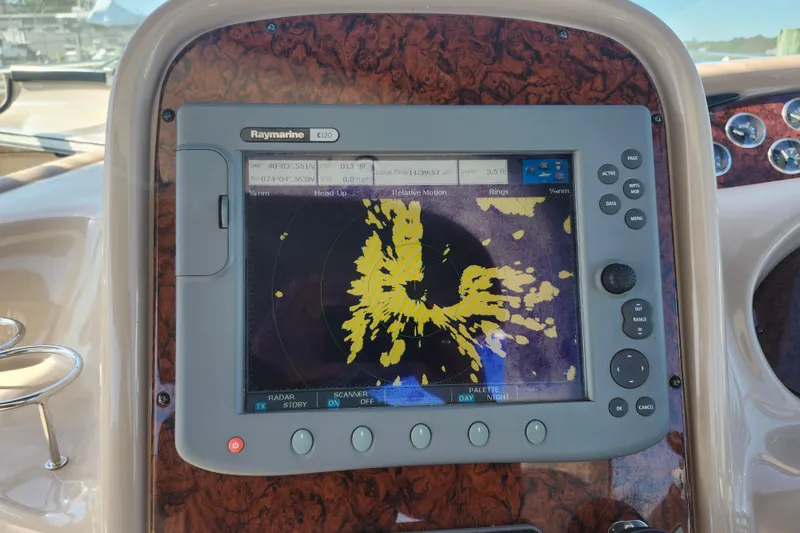 Slide: The Image of Raymarine C120 radar display on 2002 Sea Ray 410 Sundancer yacht dashboard. - 19
