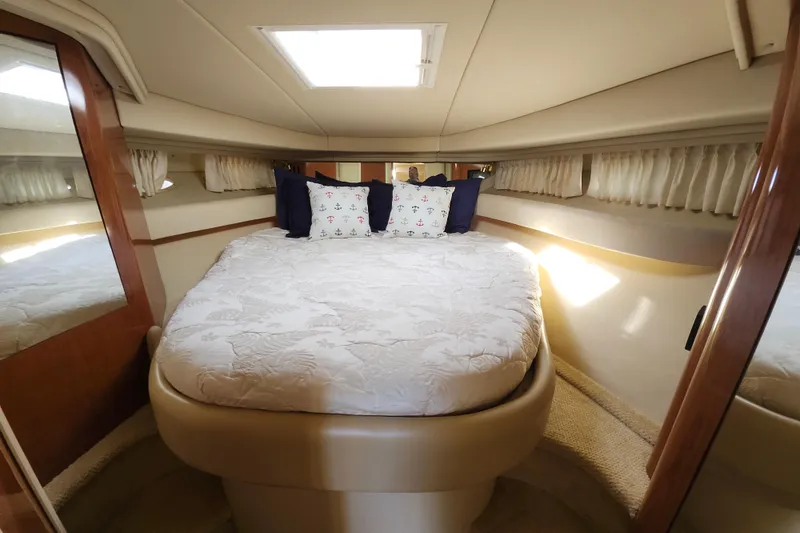 Slide: The Image of Luxurious cabin interior of 2002 Sea Ray 410 Sundancer yacht with cozy bedding. - 34