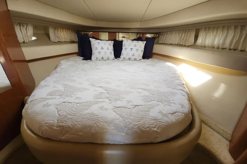 Slide: The Image of Luxurious cabin interior of 2002 Sea Ray 410 Sundancer yacht with cozy bedding. - 35