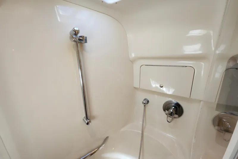 Slide: The Image of Shower area in 2002 Sea Ray 410 Sundancer yacht, featuring chrome fixtures and sleek design. - 37