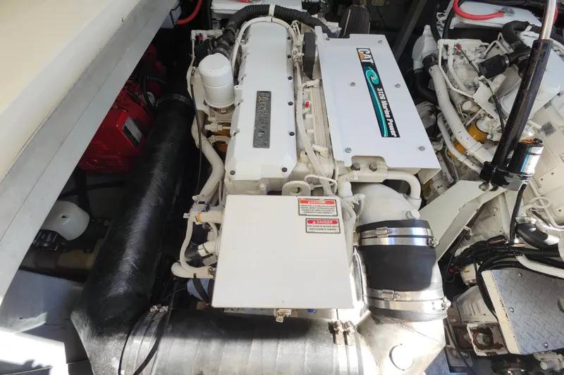 Slide: The Image of Engine compartment of a 2002 Sea Ray 410 Sundancer, featuring a CAT marine engine. - 42