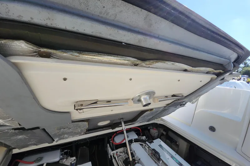 Slide: The Image of Engine compartment of 2002 Sea Ray 410 Sundancer boat, showing mechanical components. - 45