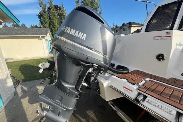 Slide: The Image of 2020 Cutwater C-24 Coupe with Yamaha outboard motor, docked outdoors. - 14