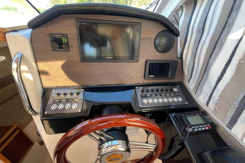 Slide: The Image of 2020 Cutwater C-24 Coupe helm with Garmin display and wood steering wheel. - 28