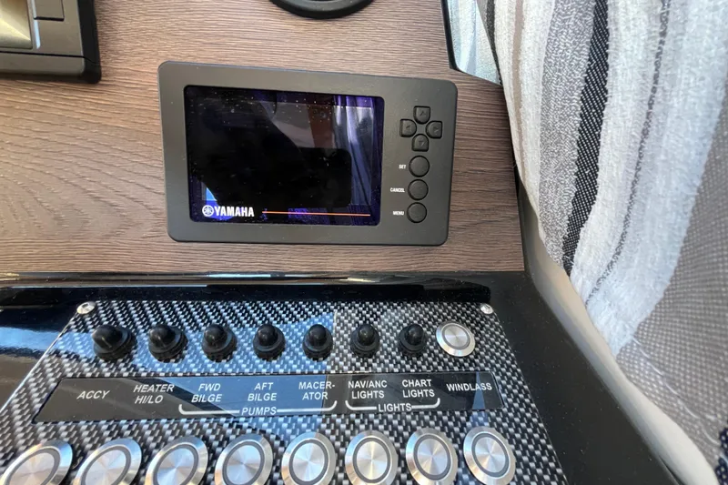 Slide: The Image of Control panel of 2020 Cutwater C-24 Coupe with Yamaha display and various switches. - 29