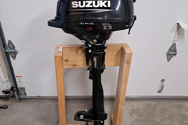 Slide: The Image of Suzuki outboard motor on wooden stand, suitable for 2019 Ranger Tugs R-31 S. - 32
