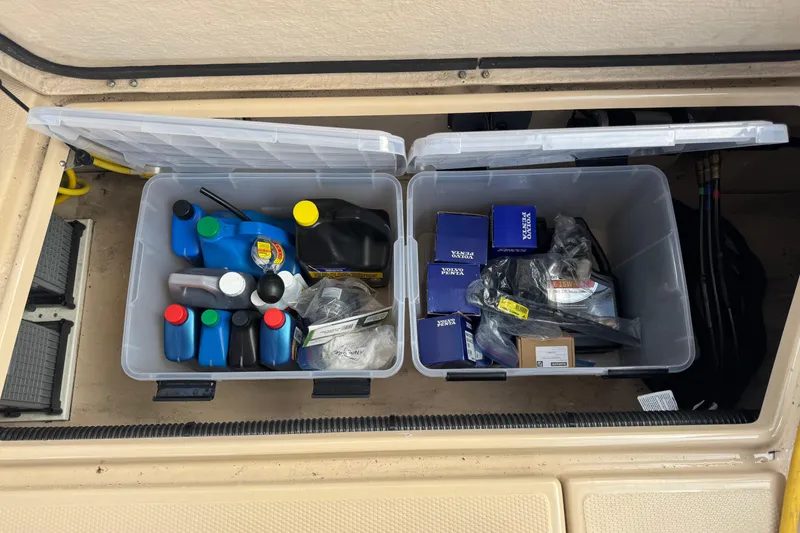 Slide: The Image of Storage compartment of 2019 Ranger Tugs R-31 S with maintenance supplies and parts. - 34