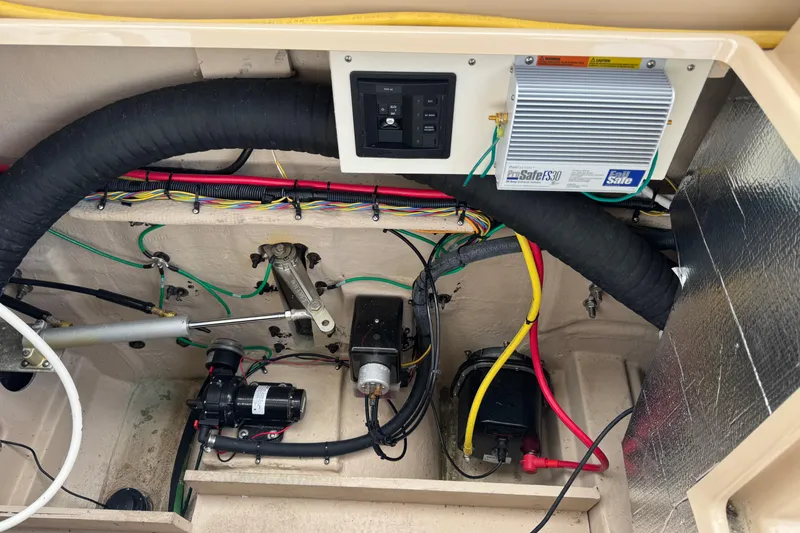 Slide: The Image of 2019 Ranger Tugs R-31 S engine compartment with wiring and components. - 42