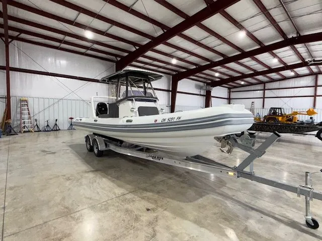 The Image of 2015 Brig Inflatables Eagle 780 boat on trailer in spacious indoor storage facility. - 0