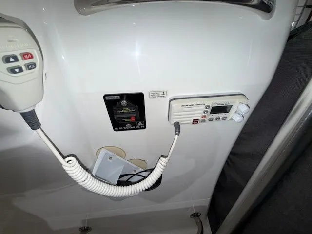 Slide: The Image of Control panel of a 2015 Brig Inflatables Eagle 780 boat with communication equipment. - 12