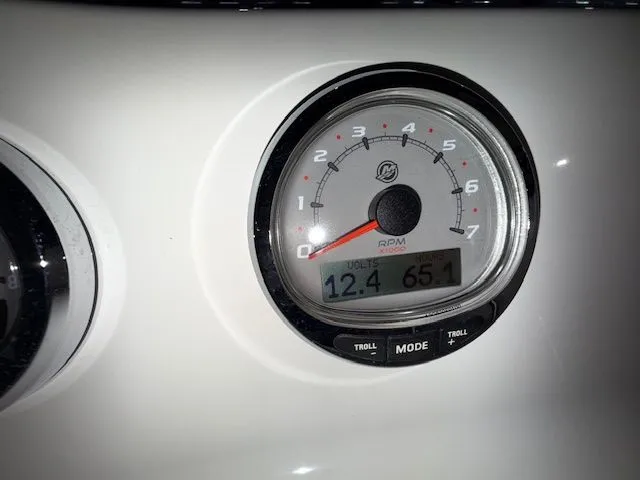 Slide: The Image of Close-up of a 2015 Brig Inflatables Eagle 780 RPM gauge displaying 12.4 volts and 65.1 RPM. - 13