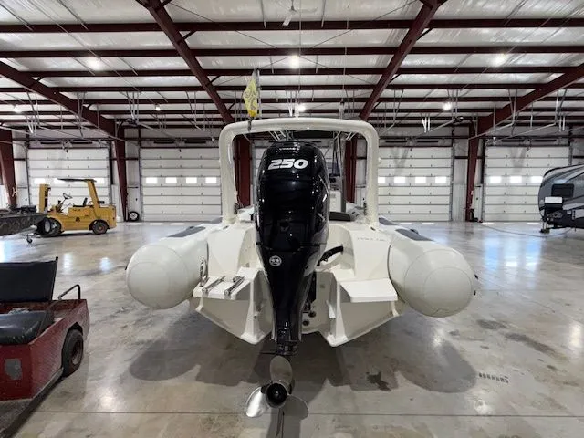 Slide: The Image of 2015 Brig Inflatables Eagle 780 with 250 HP engine in a spacious warehouse. - 3