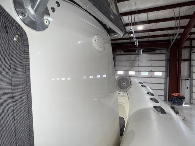 Slide: The Image of 2015 Brig Inflatables Eagle 780 in a warehouse, showcasing sleek design and durable construction. - 4