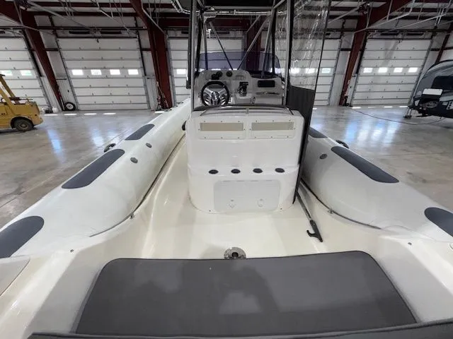Slide: The Image of 2015 Brig Inflatables Eagle 780 boat interior in a spacious warehouse setting. - 7