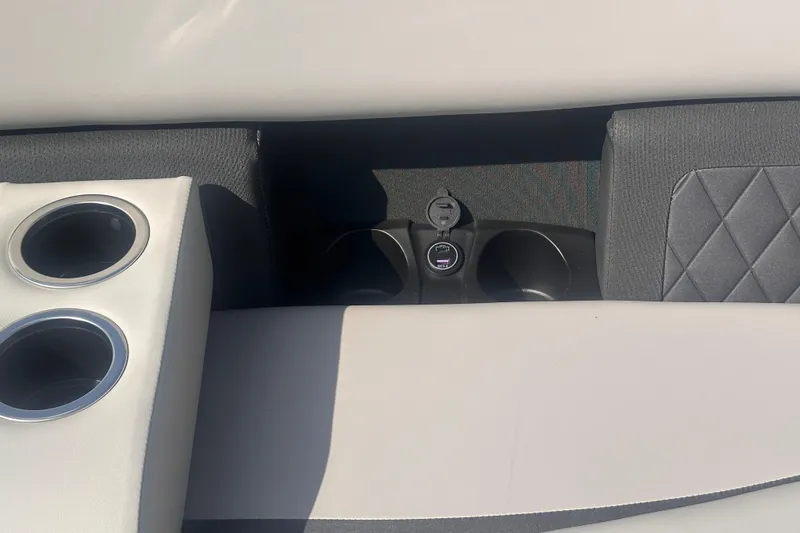 Slide: The Image of 2026 Starcraft CX 23 DL BAR interior with cup holders and USB port. - 10