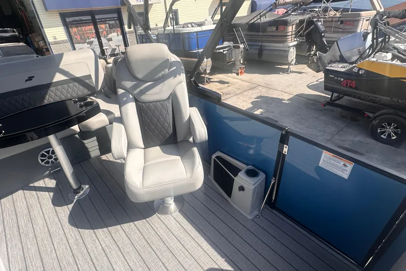 Slide: The Image of 2026 Starcraft CX 23 DL BAR boat interior with plush seating and sleek design. - 13