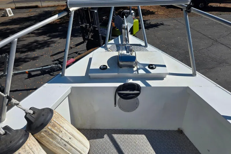 Slide: The Image of 2020 Raider 250 Sea Raider boat deck with anchor and railings. - 13