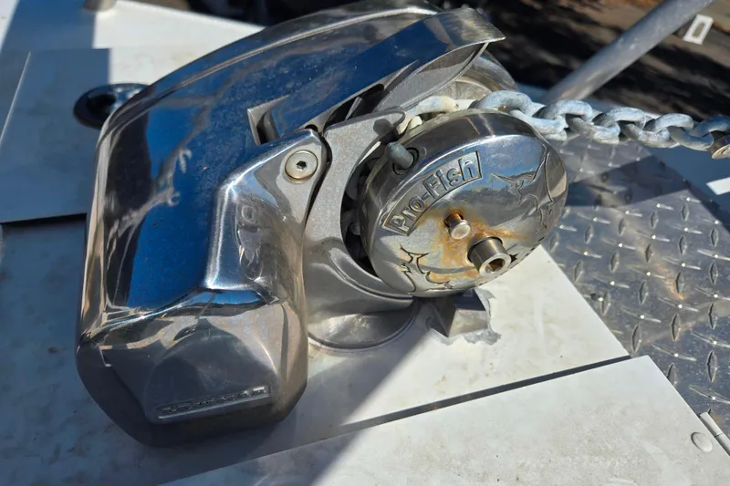 Slide: The Image of Chrome anchor winch on 2020 Raider 250 Sea Raider boat deck. - 16