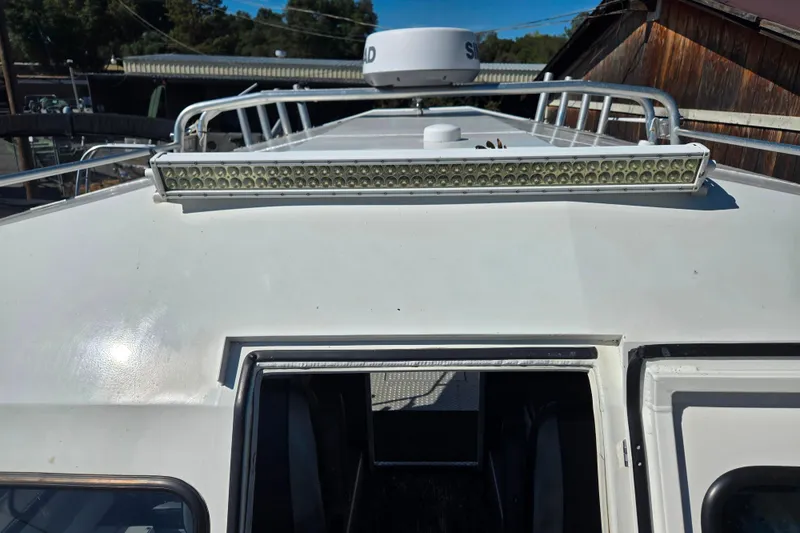 Slide: The Image of 2020 Raider 250 Sea Raider boat roof with LED light bar and radar dome. - 29