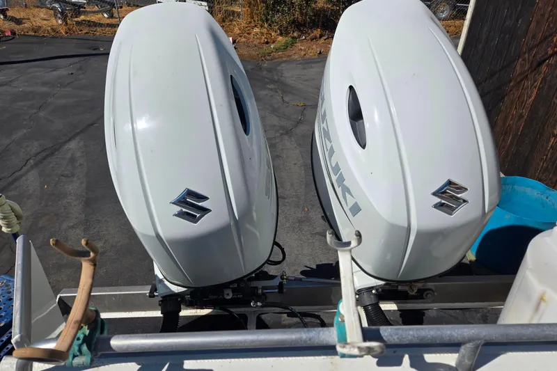 Slide: The Image of Twin Suzuki outboard motors on a 2020 Raider 250 Sea Raider boat. - 5