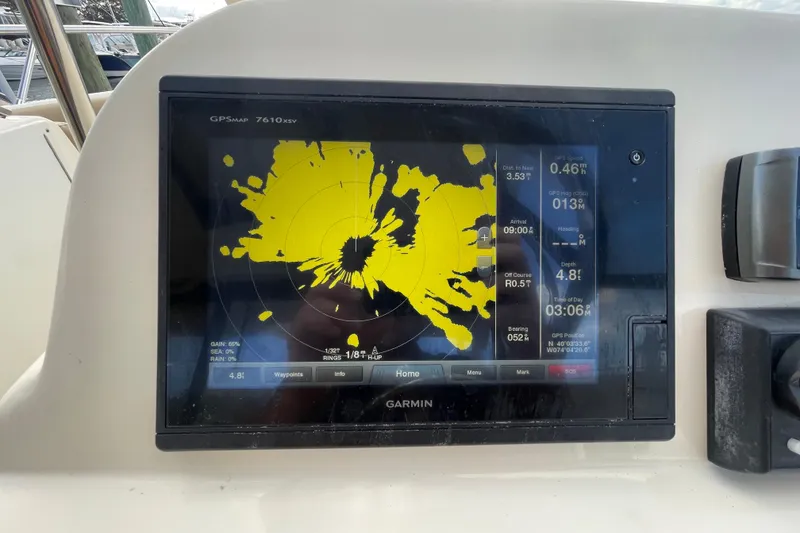 Slide: The Image of Garmin GPS display on 2015 Scout 245 Dorado boat, showing navigation data and radar. - 20