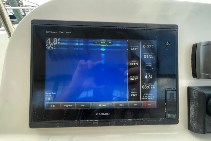 Slide: The Image of Garmin GPS display on 2015 Scout 245 Dorado boat, showing navigation and depth data. - 21