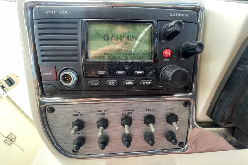 Slide: The Image of Garmin VHF 200 radio and control panel on 2015 Scout 245 Dorado boat. - 26