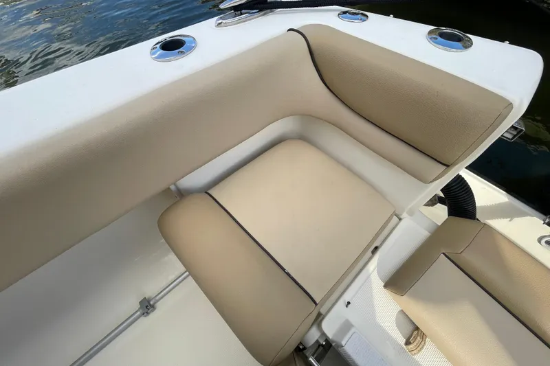 Slide: The Image of Beige seating on a 2015 Scout 245 Dorado boat, near water. - 33