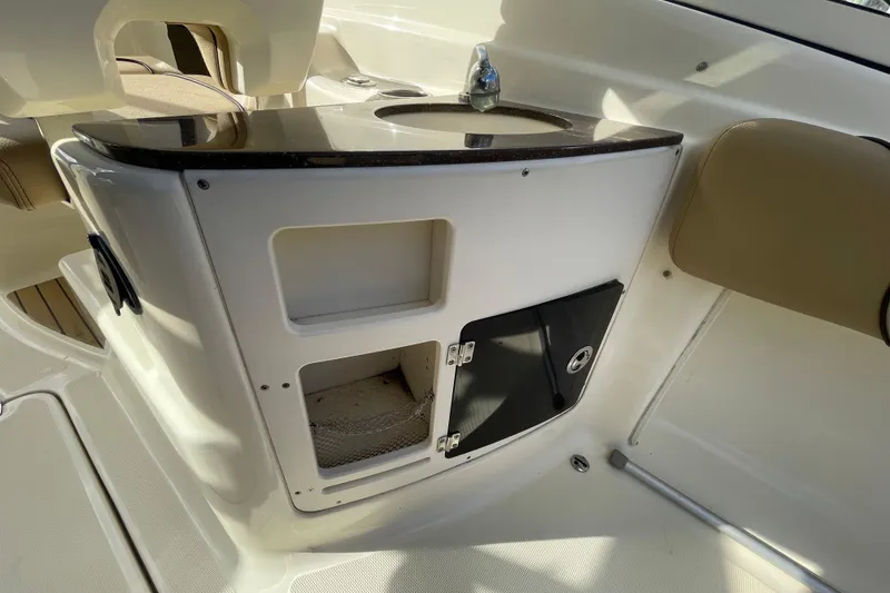 Slide: The Image of 2015 Scout 245 Dorado boat interior with sink and storage compartments. - 38