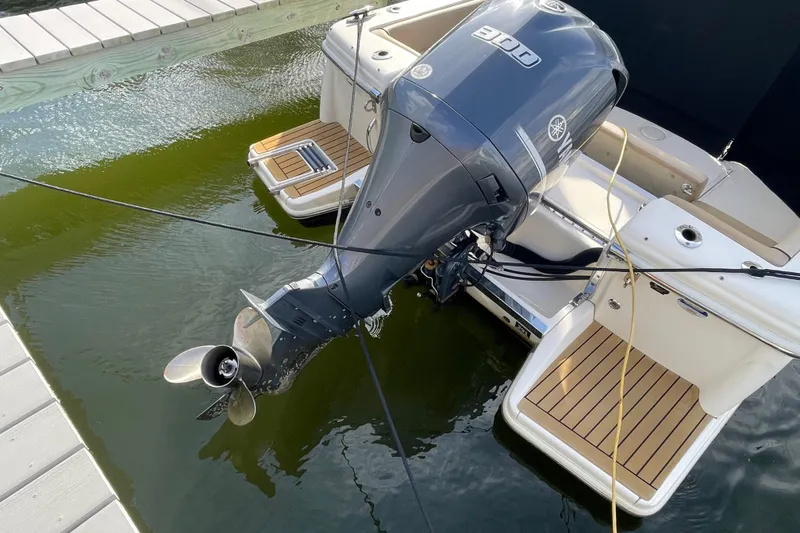 Slide: The Image of 2015 Scout 245 Dorado boat with Yamaha outboard motor docked in water. - 42